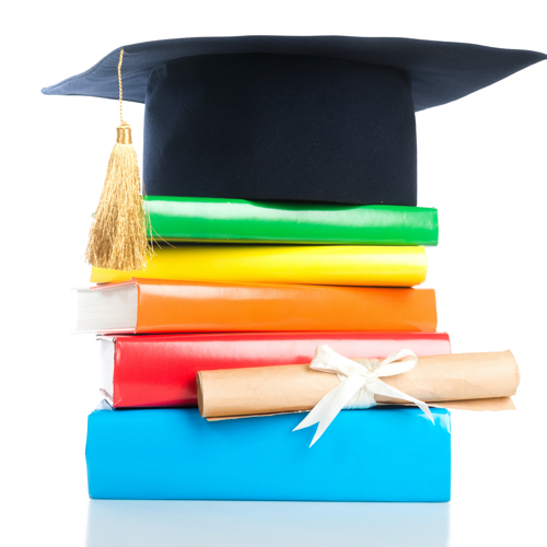 mortarboard and vintage graduation scroll, tied with red ribbon, on a stack of books